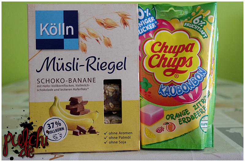 Kölln Müsli-Riegel „Schoko-Banane“ || Chupa Chups Kaubonbon „Orange Zitrone Erdbeere“